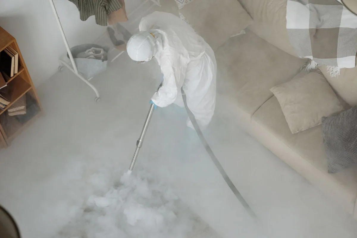 Biohazard cleanup technician in protective equipment, North Fond du Lac, WI